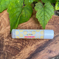 Tube of Passionfruit lip balm on a board